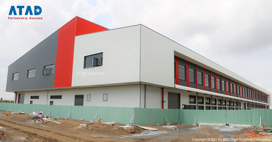 A large precast steel structure office building with pitched roof and concrete foundation