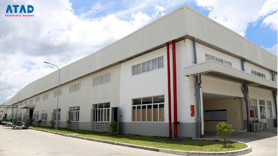 A large precast steel structure office building with pitched roof and concrete foundation